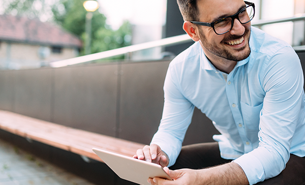 Joyful Man With Tablet- Salesforce Integration