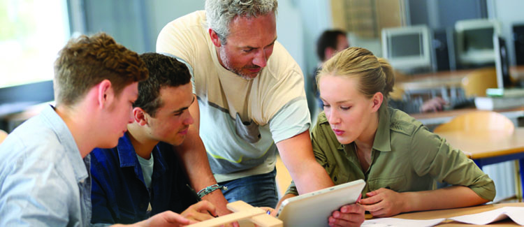 People Gathered Around Digital Asset Management System Tablet