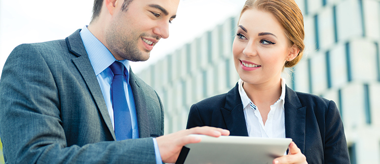 Sales and Content Marketing Professionals Looking at Tablet