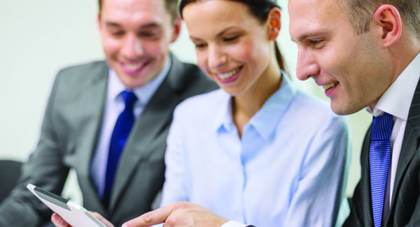 Marketing Team Using Sales Enablement Platform on Tablet