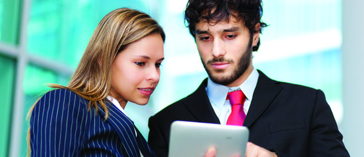 Two People Looking at Enterprise Content Management System Tablet