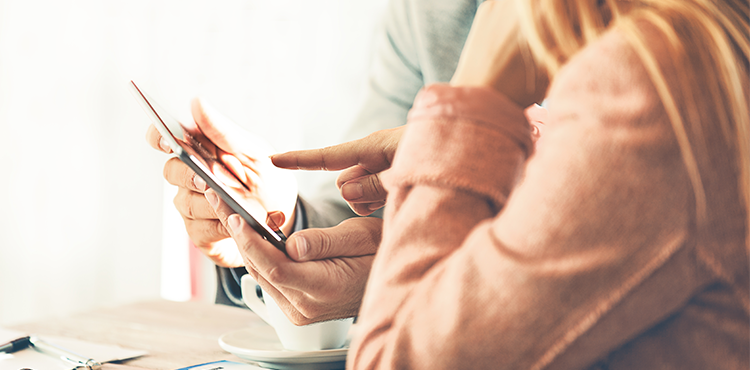Platform-Features People Pointing at Digital Sales Enablement Tool via the Tablet