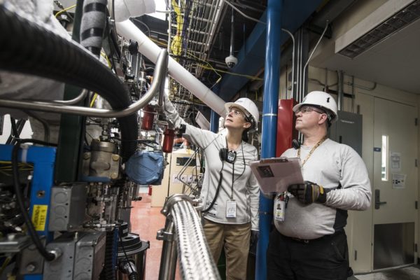 MFG Inspector Two People Looking at Enterprise Content Management System Tablet